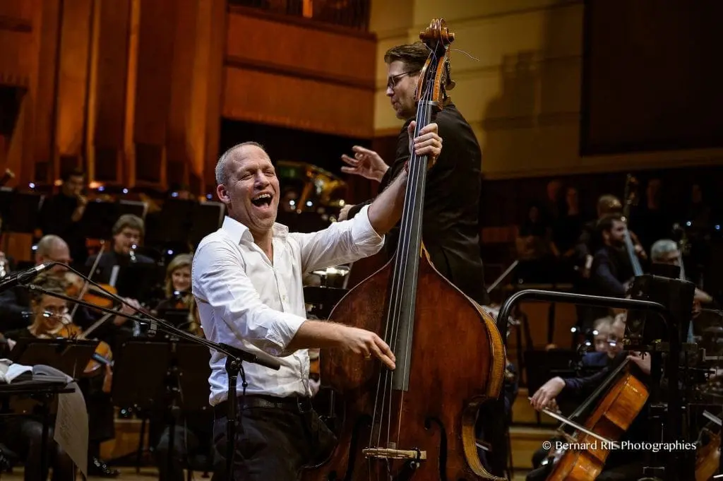 Avishai Cohen playing -double bass with orchestra