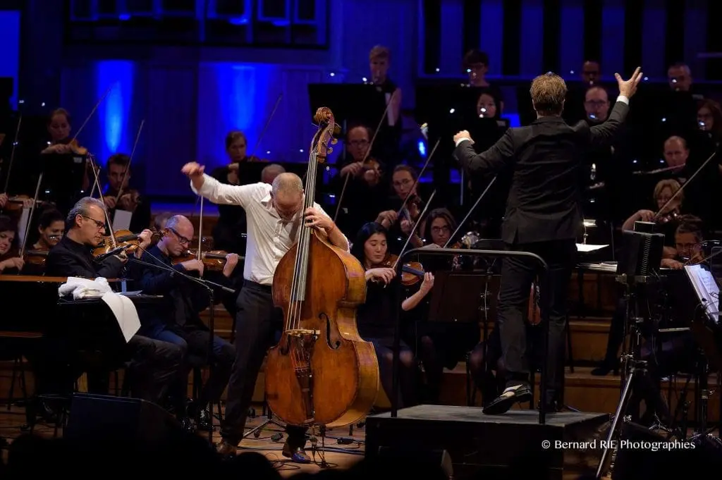 Avishai Cohen with orchestra and conductor